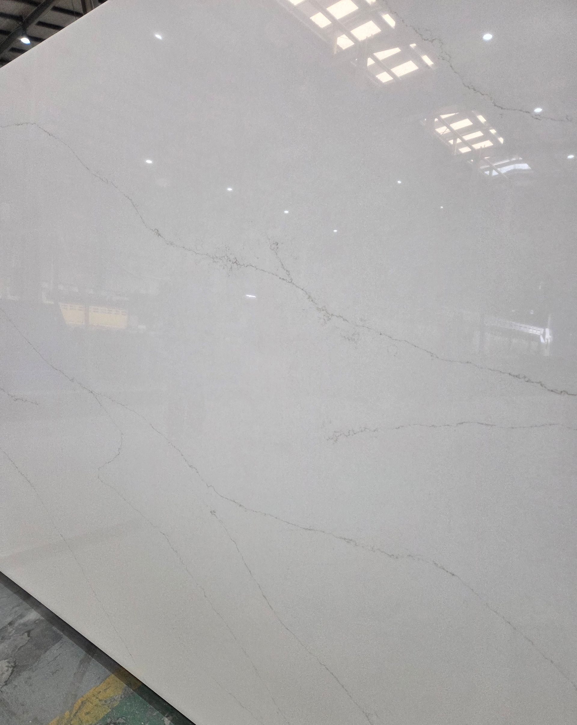 A White Quartz Slab Featuring Subtle, Thin Gray Veining in a Light, Polished Finish — Better Stone in Caloundra West, QLD