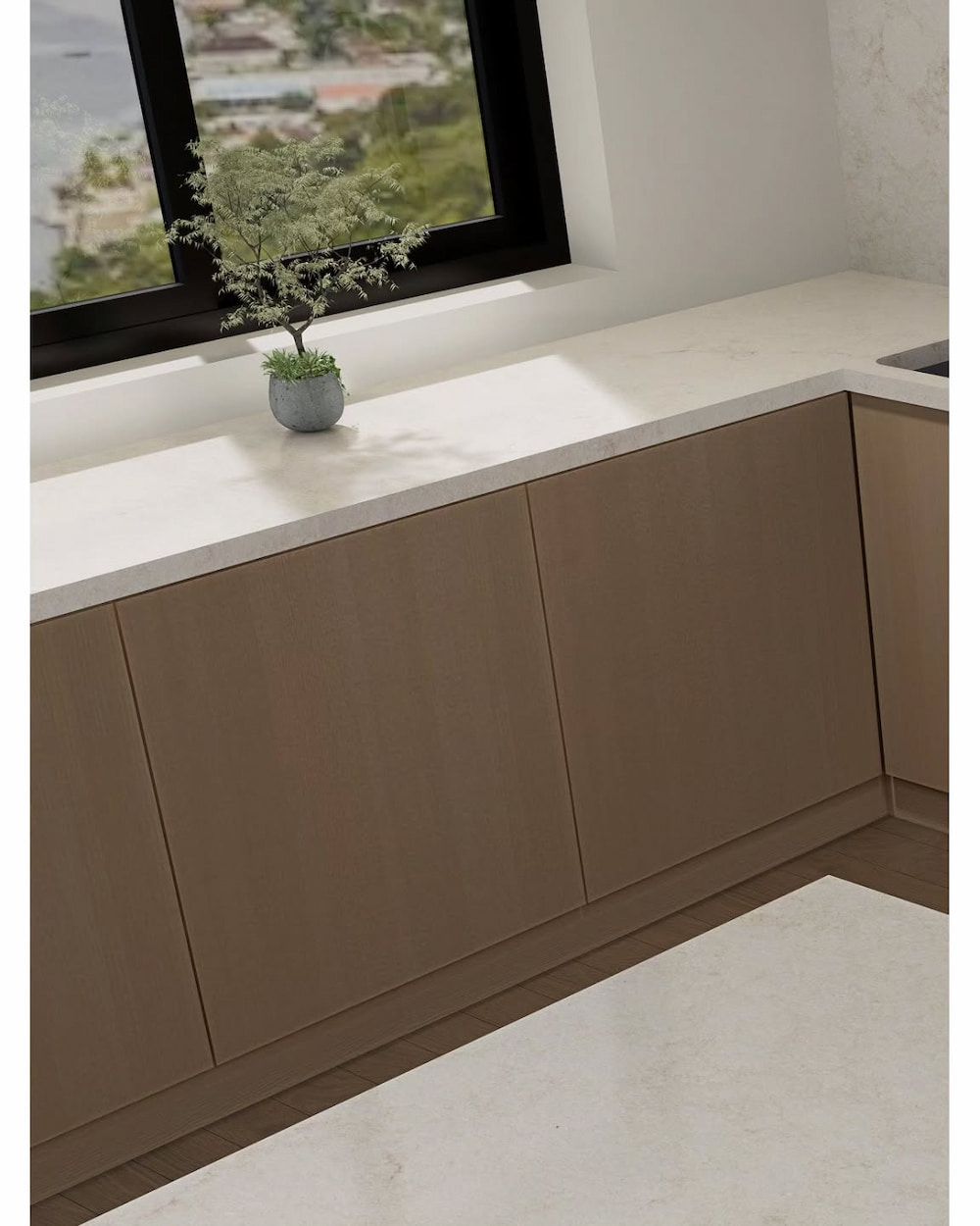 A Potted Plant is Sitting on a Counter in a Kitchen Next to a Window — Better Stone in Gold Coast, QLD