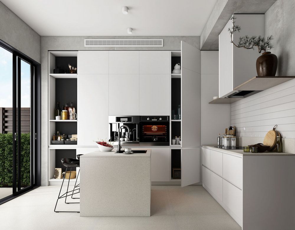 A Kitchen With White Cabinets and a Large Island in the Middle — Better Stone in Caloundra West, QLD