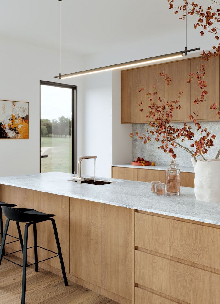 A Kitchen With A Large Island And Granite Counter Tops — Better Stone in Caloundra West, QLD