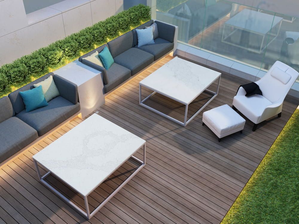 An Aerial View of a Patio With a Couch, Table and Chairs — Better Stone in Caloundra West, QLD