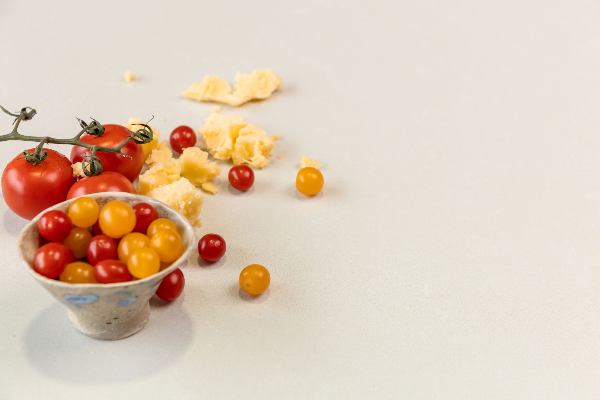There is a Bowl of Tomatoes and Cheese on the Table — Better Stone in Caloundra West, QLD