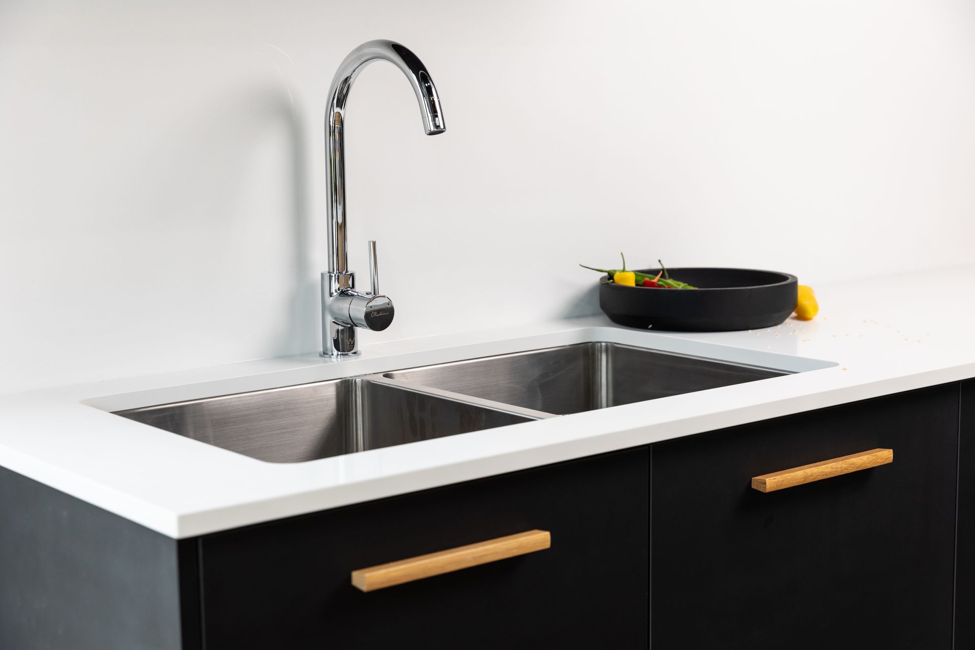 A Kitchen Sink With a Faucet and a Bowl of Lemons on the Counter — Better Stone in Caloundra West, QLD