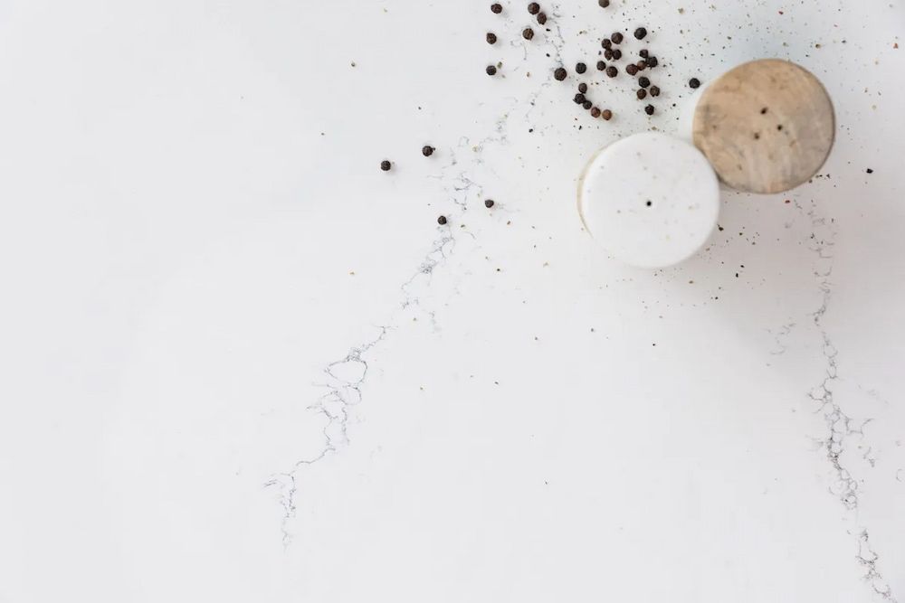 A White Counter Top With Salt and Pepper Shakers on It — Better Stone in Caloundra West, QLD