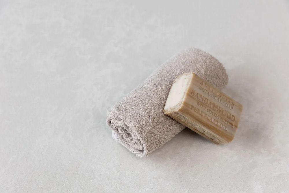 A Towel and a Bar of Soap Are on a White Surface — Better Stone in Caloundra West, QLD