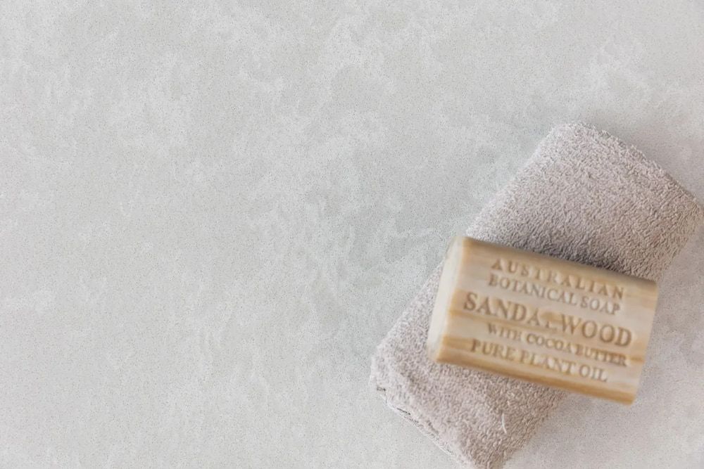 A Bar of Soap is Sitting on Top of a Towel on a Table — Better Stone in Caloundra West, QLD