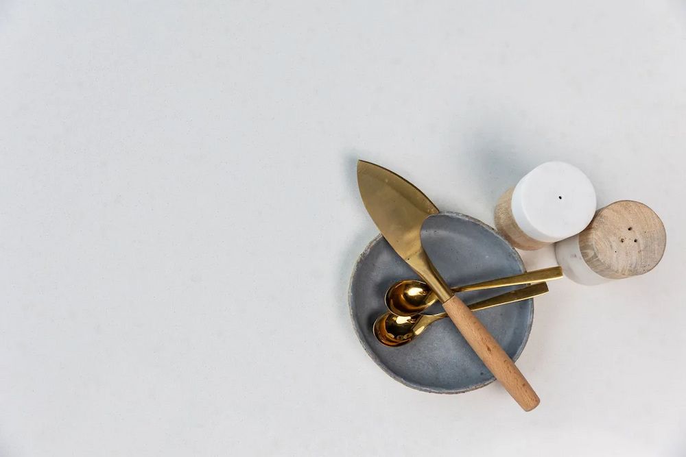 A Bottle of Perfume is Sitting on Top of a Notebook Next to a Cell Phone. — Better Stone in Caloundra West, QLD