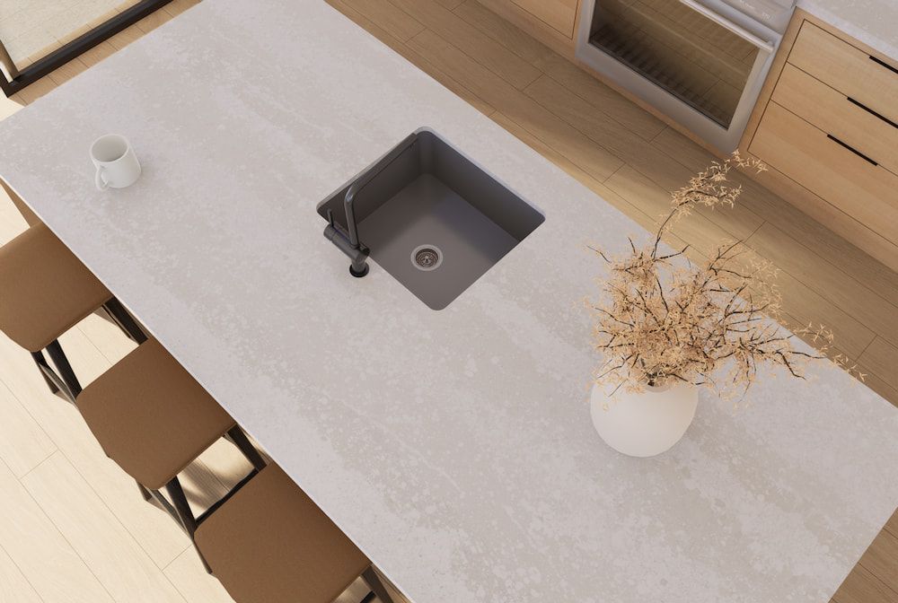 A Kitchen Counter With a Sink and a Vase of Flowers on It — Better Stone in Caloundra West, QLD