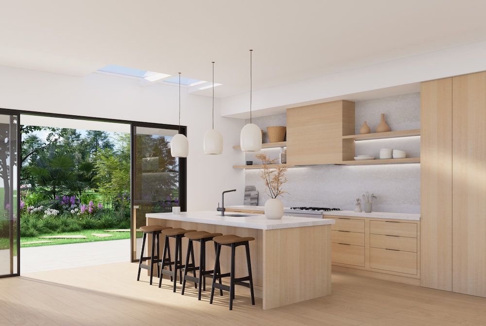 An Artist's Impression of a Kitchen With a Large Island and Stools — Better Stone in Caloundra West, QLD