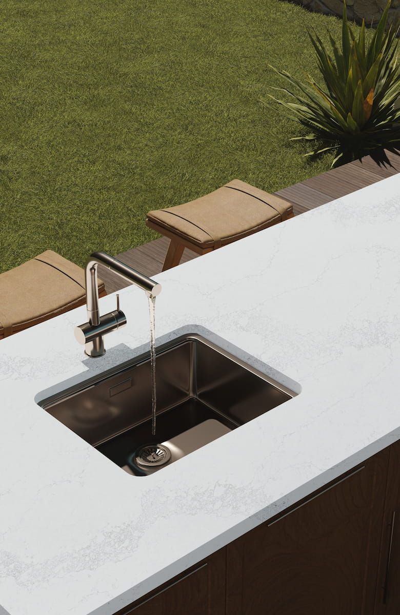 A Stainless Steel Sink is Sitting on Top of a White Counter — Better Stone in Caloundra West, QLD