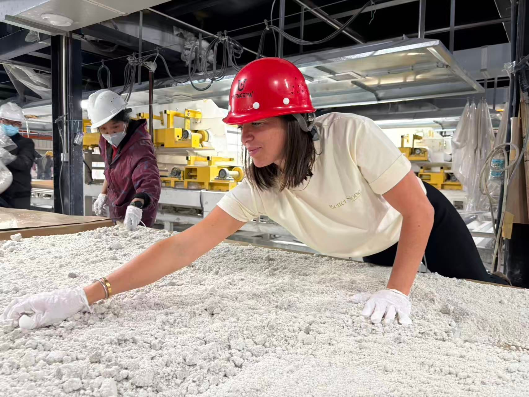 A Person in a Red Hard Hat and White Gloves Examines a Large — Better Stone in Caloundra West, QLD