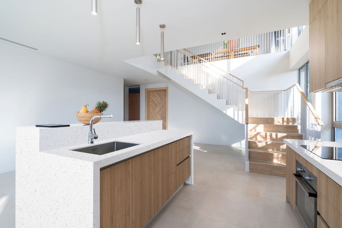 A Kitchen With a Sink and Stairs Leading Up to the Second Floor — Better Stone in Caloundra West, QLD