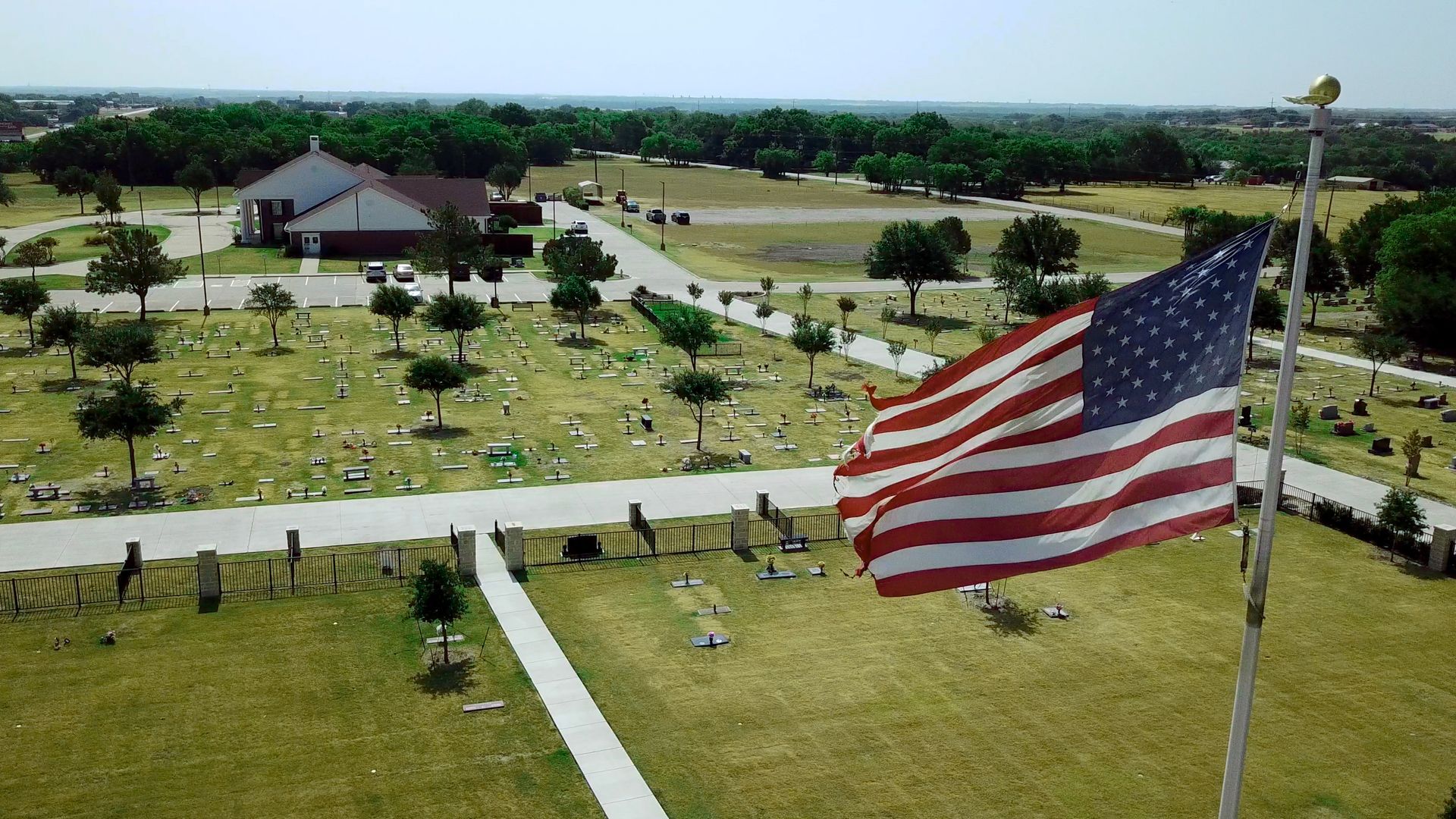 Aerial shot of New Hope Memorial Gardens with an American flag