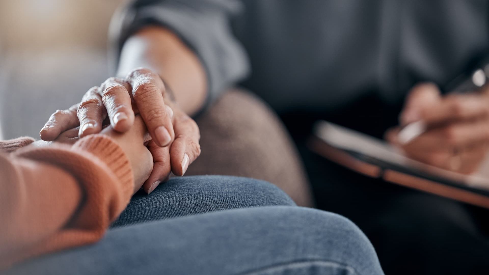A person is comforting another person during a time of loss
