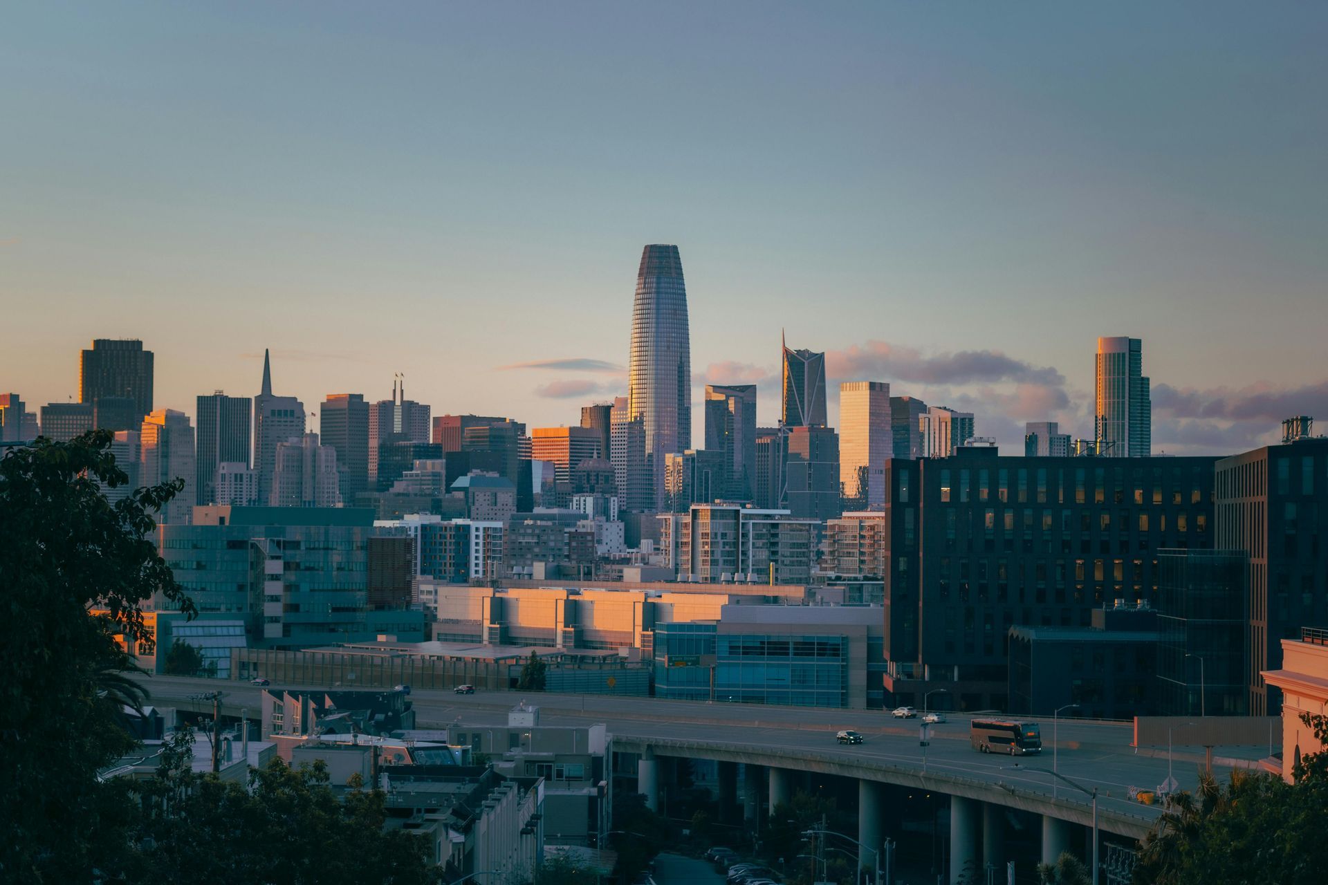 A city skyline with a bridge in the foreground