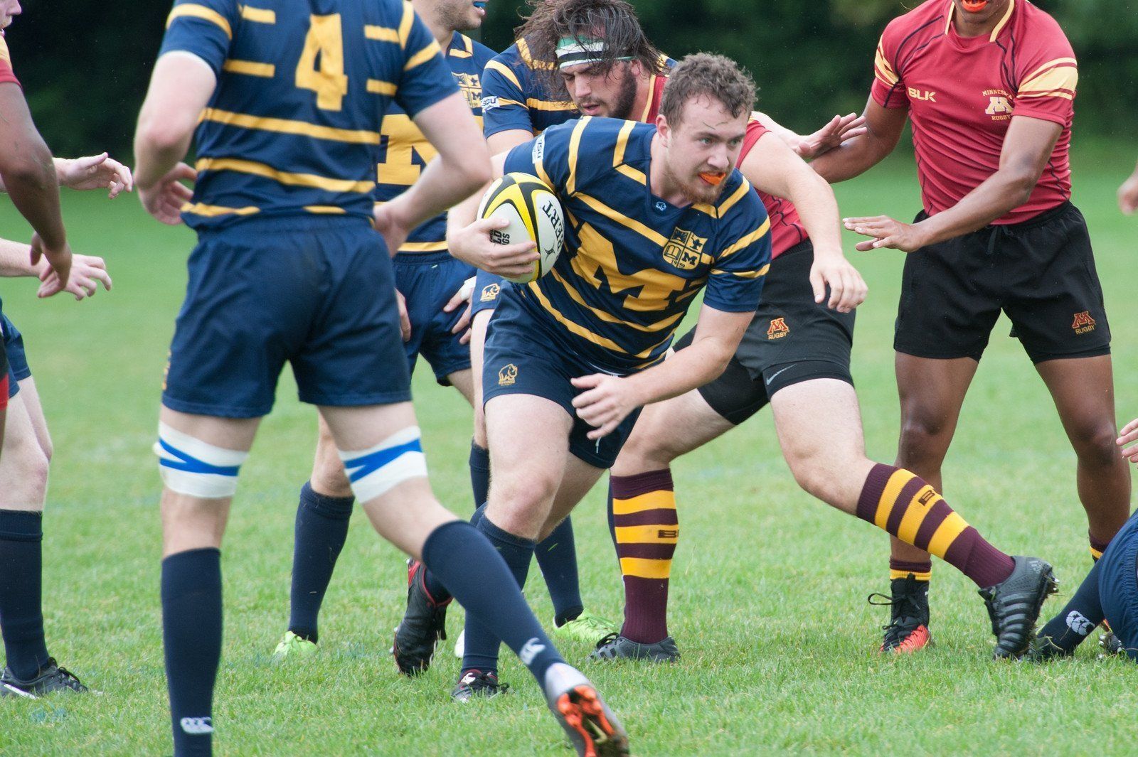 A rugby player with the number 4 on his jersey