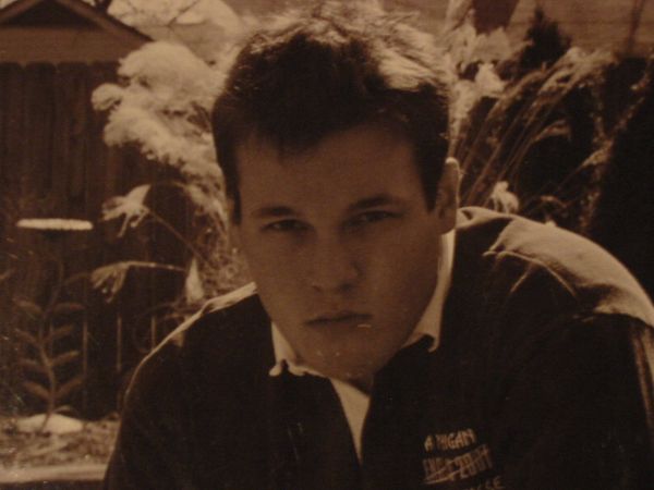A man wearing a black jacket with the word decathlon on it