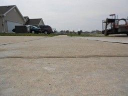 Sidewalk in Champaign, IL before in the process of raising and leveling by a local contractor.
