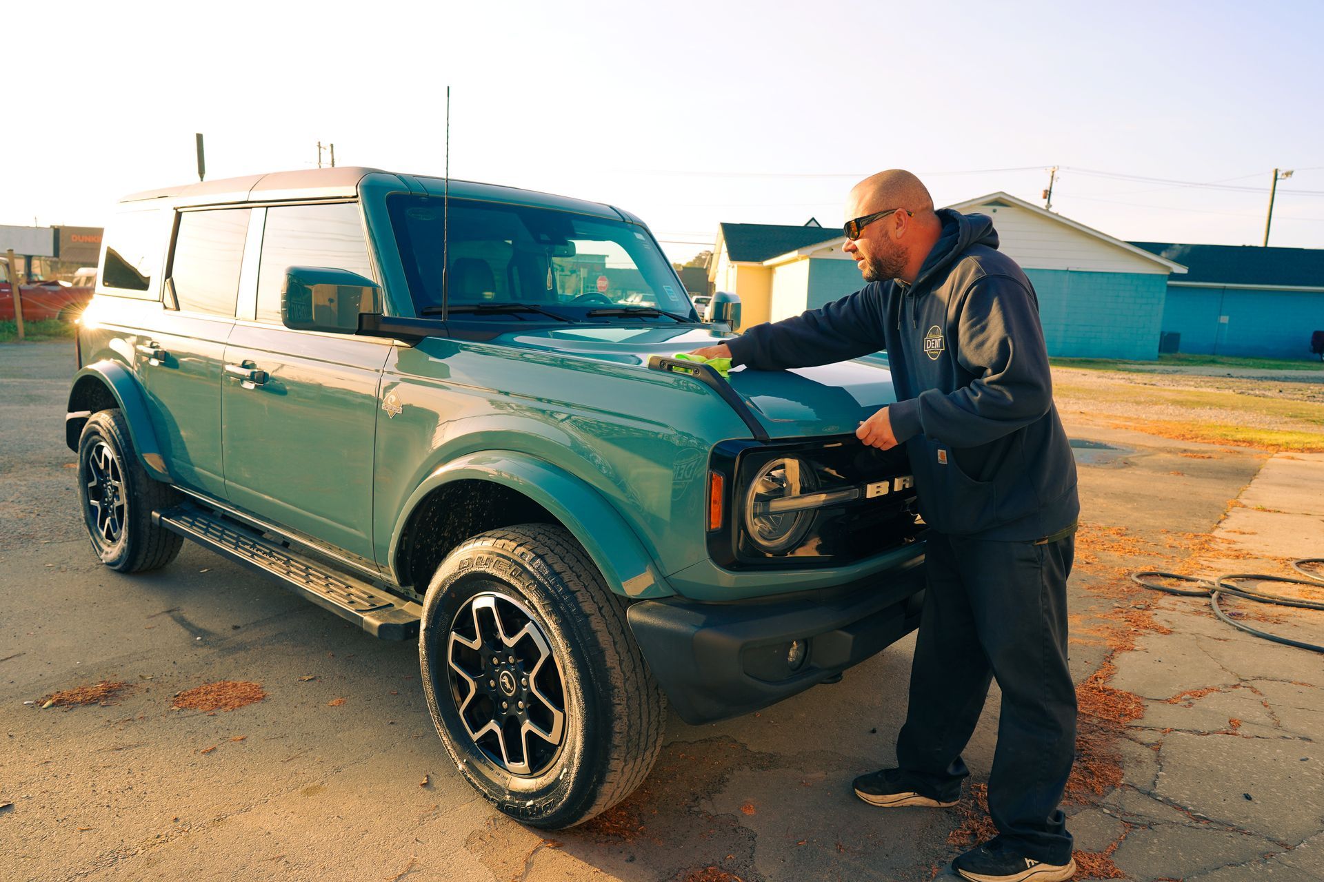 Pdr technician double checking his hail damage repairs that he completed on a 2025 Ford bronco  In Summerville Sc. 