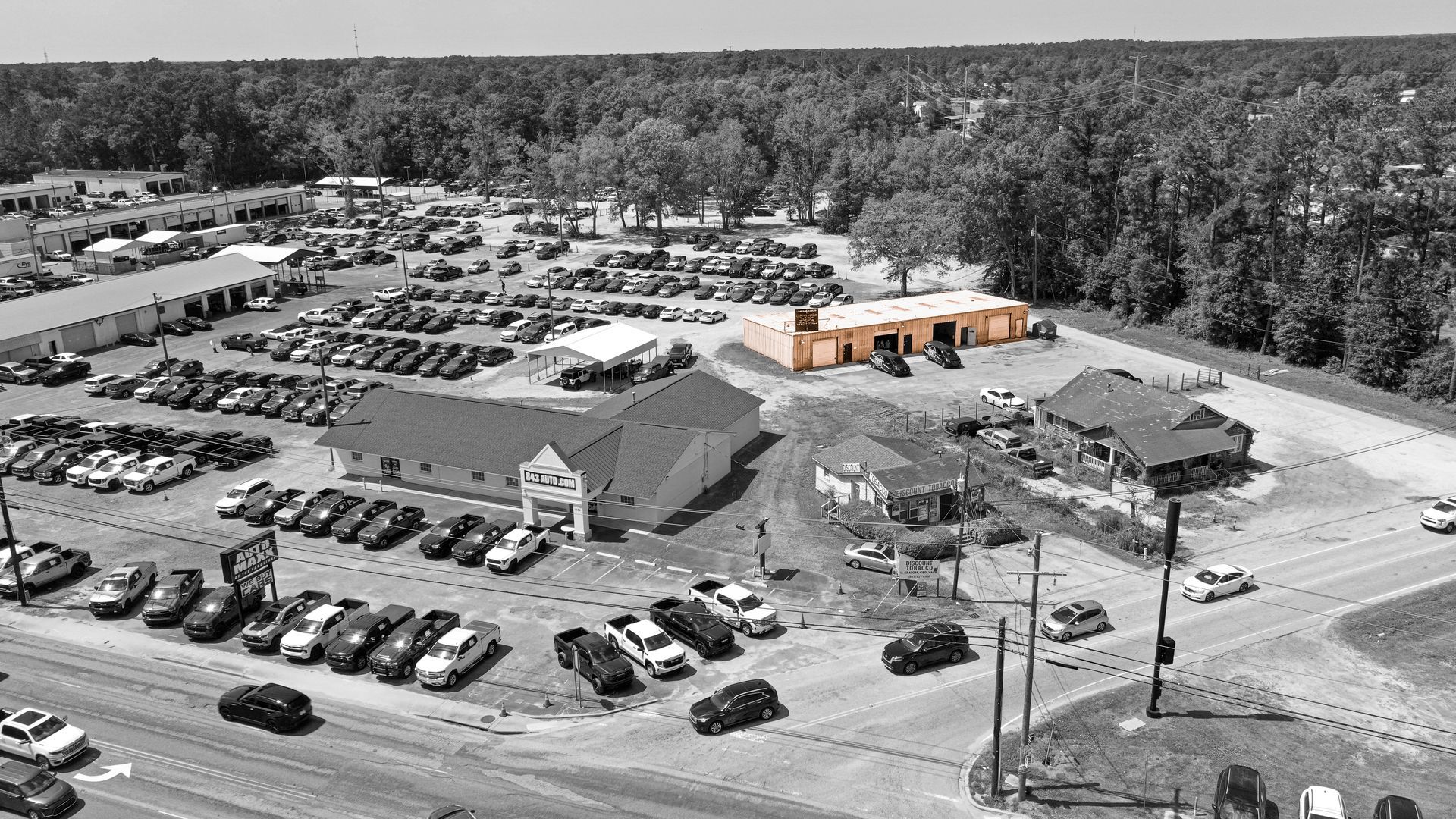 Black and white Aerial viewpoint of our shop location in summerville, with the shop standing out in color to highlight  location 
