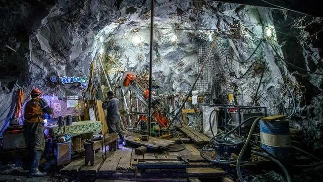 Miners Working in a Brightly Lit, Rocky Mine Shaft — Secure Mine Solutions in Port Ryan, QLD