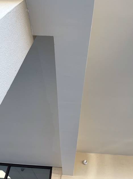 Looking up at the ceiling of a building.