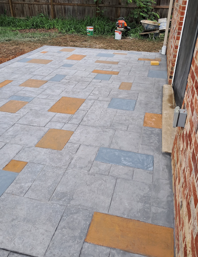 A brick building with a patio in front of it