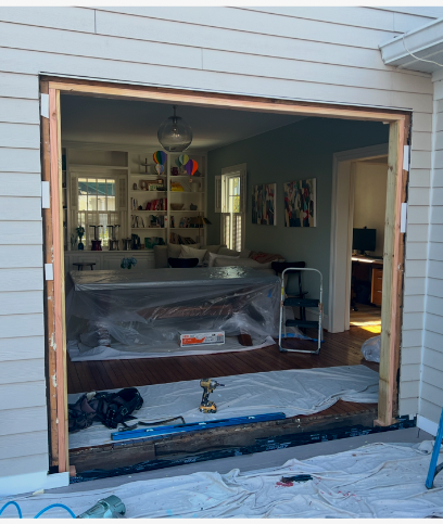 A sliding glass door is being installed in a house