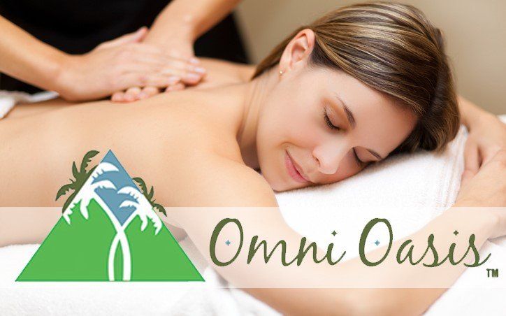 Woman receiving a back massage with “Omni Oasis” spa logo text overlaid