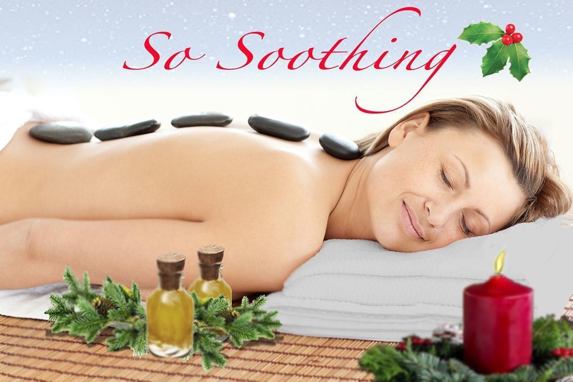 Relaxing spa massage with hot stones, candles, and a sleeping woman on a table under “So Soothing” text