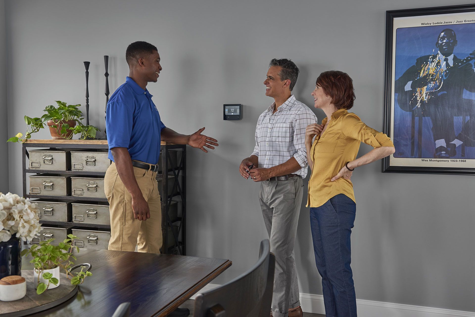 Carrier employee speaking to couple