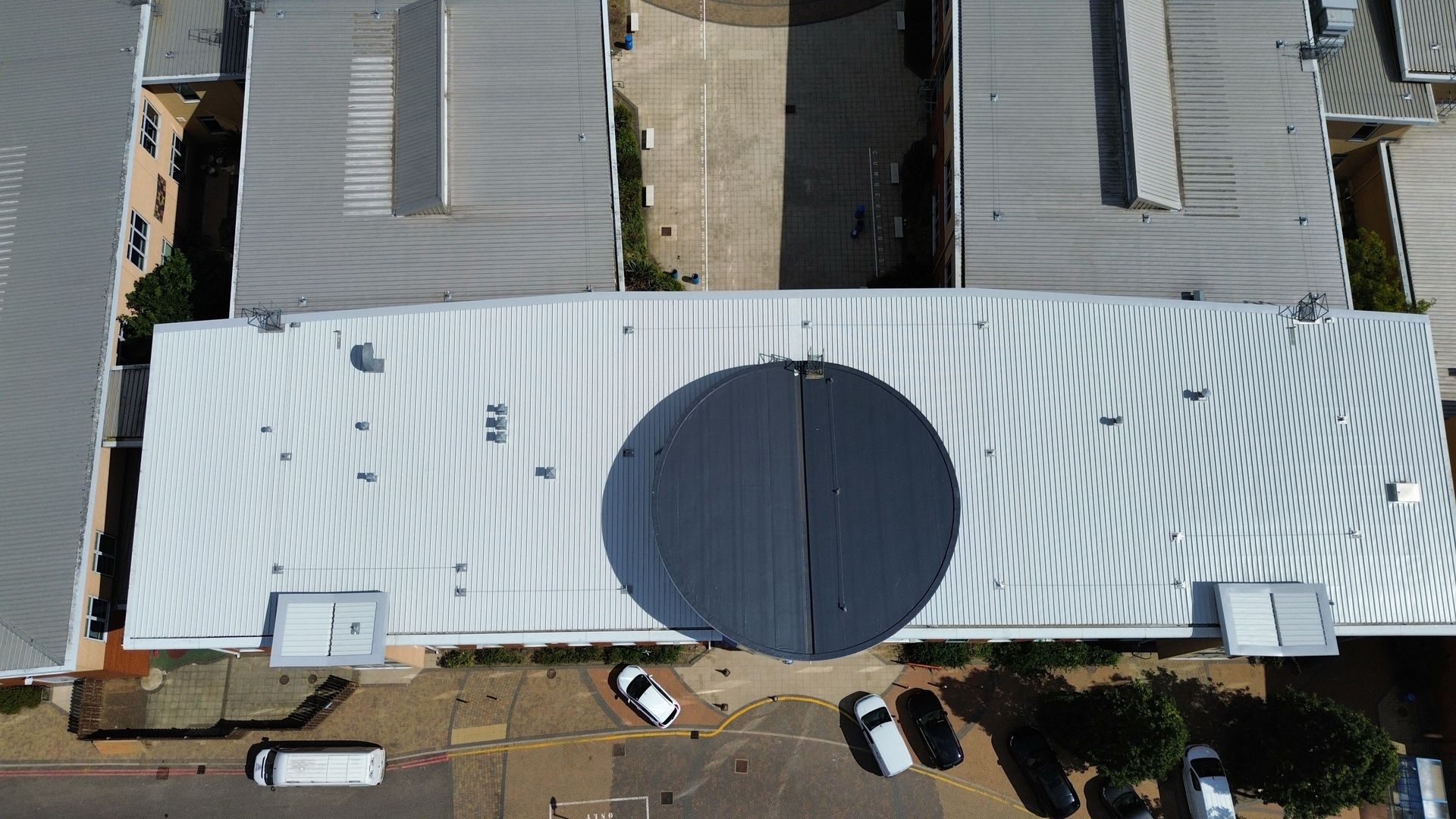 Large school roofing project re-coating aluminium roof sheets