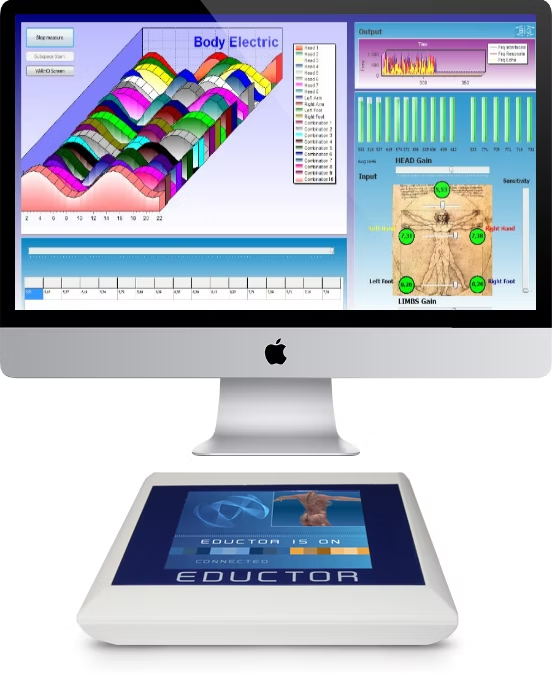 IMac displaying colorful 3D data charts above a touchscreen educational console on a white stand