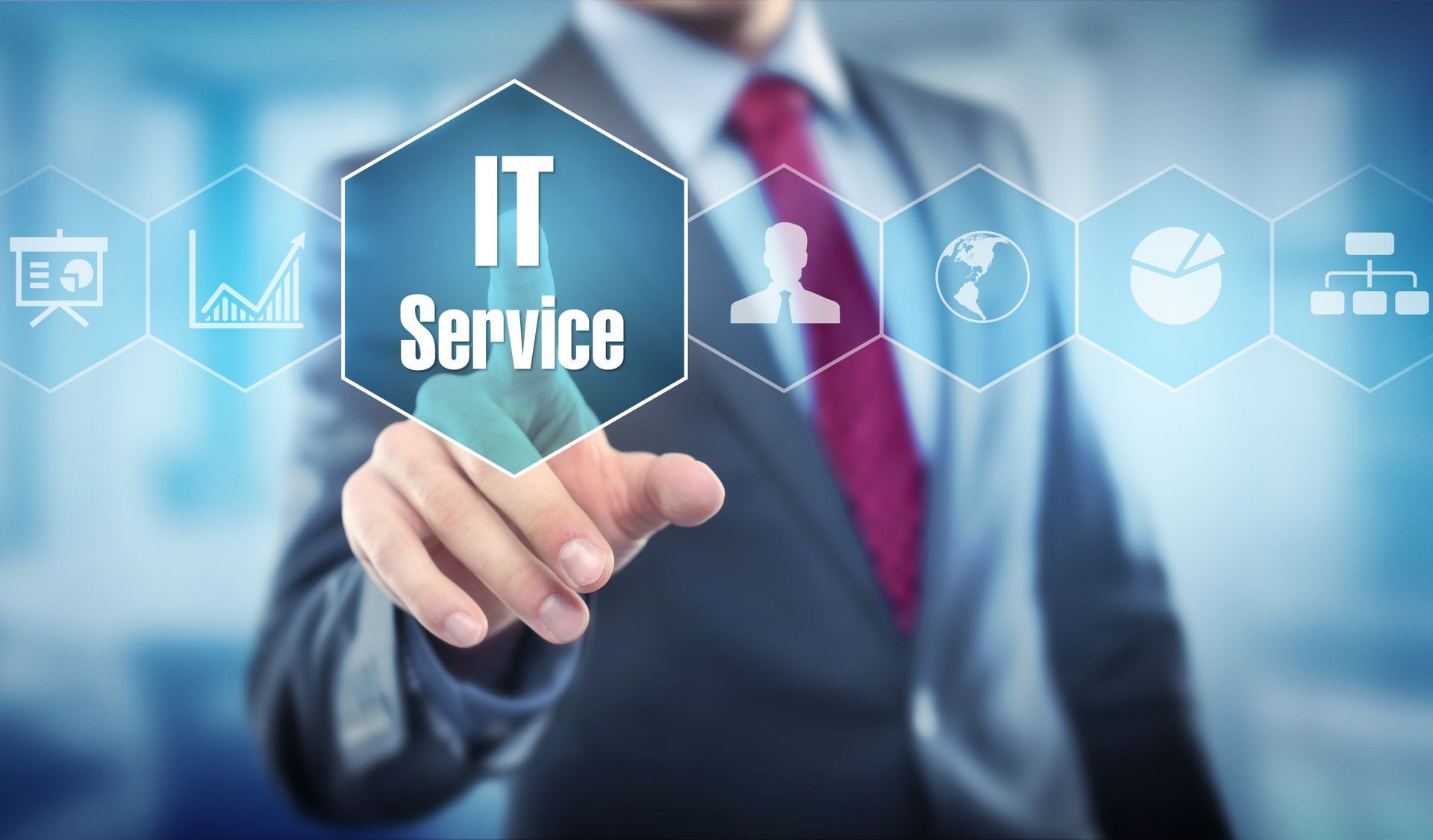 Businessman touching IT service icon on a digital interface for managed IT services.