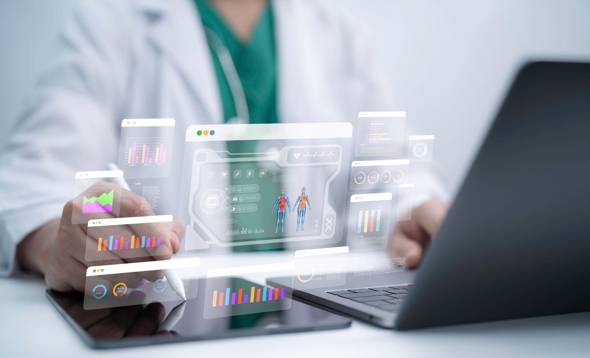 Doctor using laptop and tablet with futuristic digital medical dashboard.