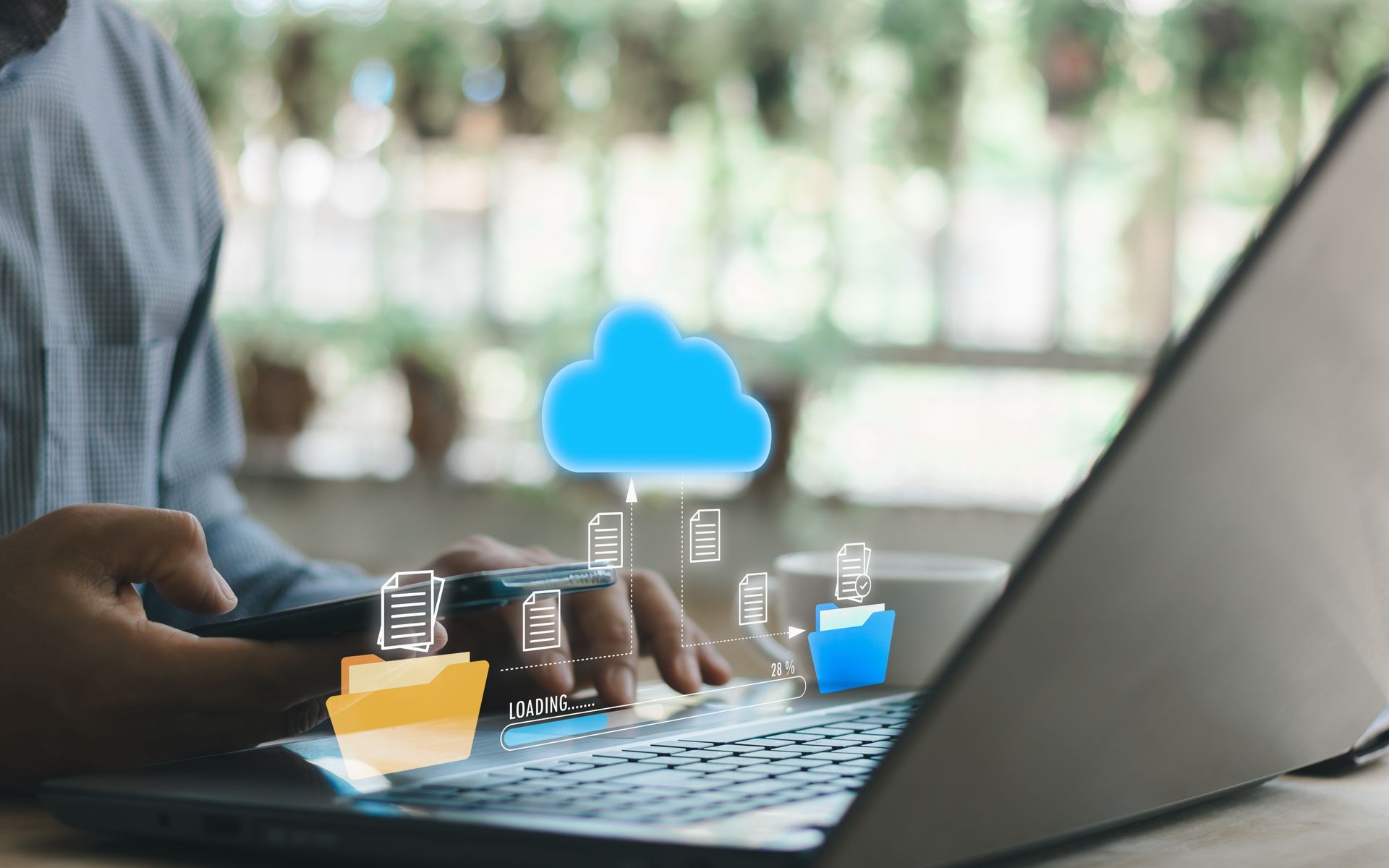 Birmingham business owner managing secure cloud files and backups on a laptop Birmingham business owner managing secure cloud files and backups on a laptop