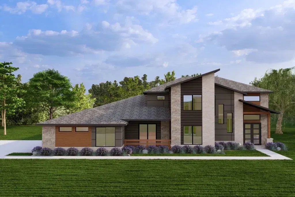 Modern single-story house with stone exterior, large windows, and a sloped roof in a grassy landscape.