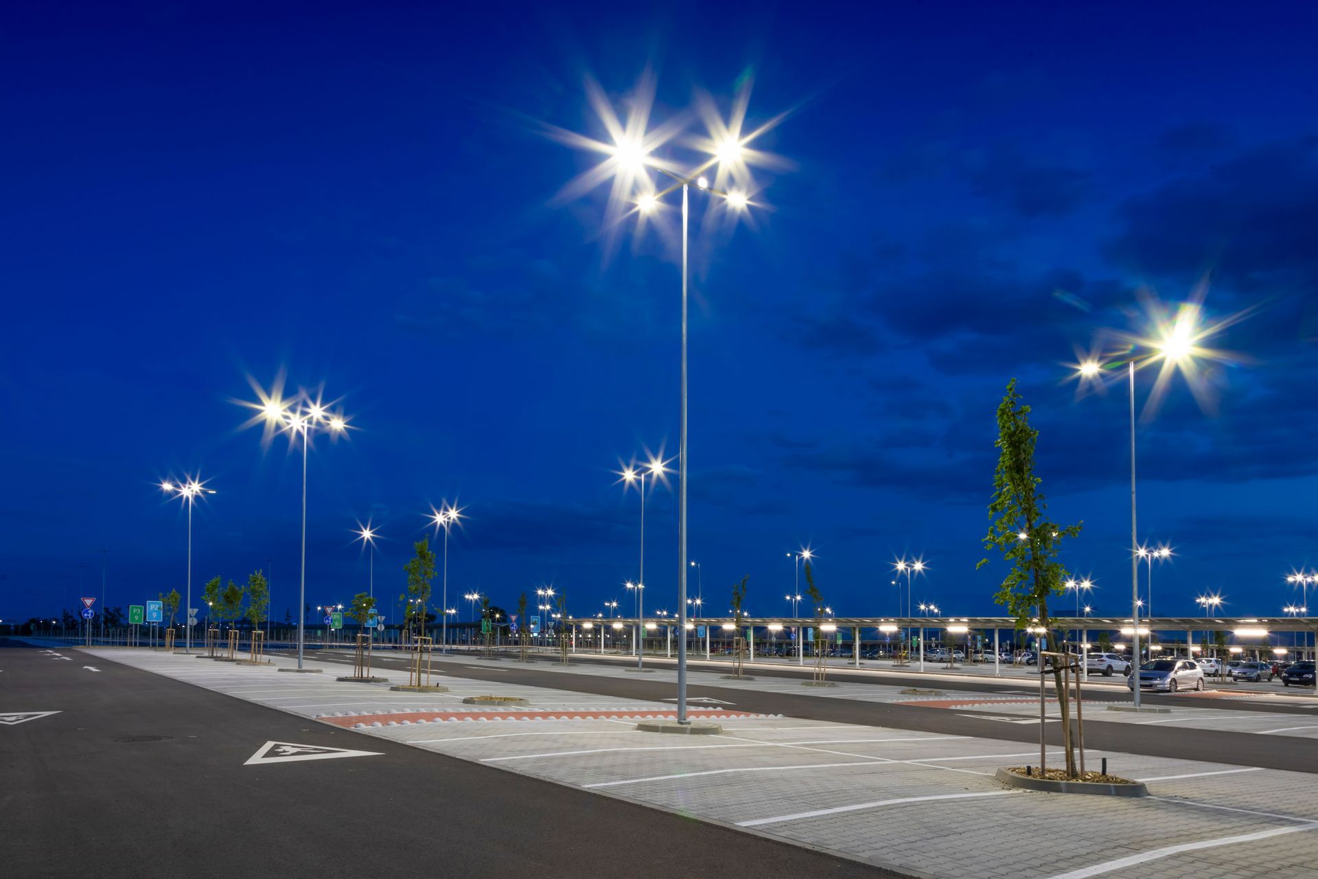 A parking lot with lots of lights on at night