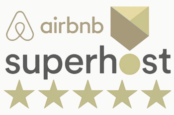 Airbnb Superhost logo with five gold stars and beige emblem