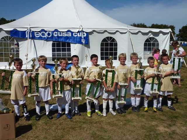 Team Challenger FC team holding trophies