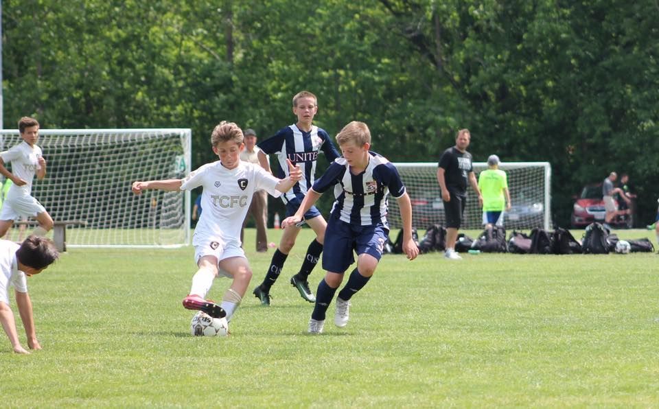 Team Challenger FC player dribbling the ball during a game