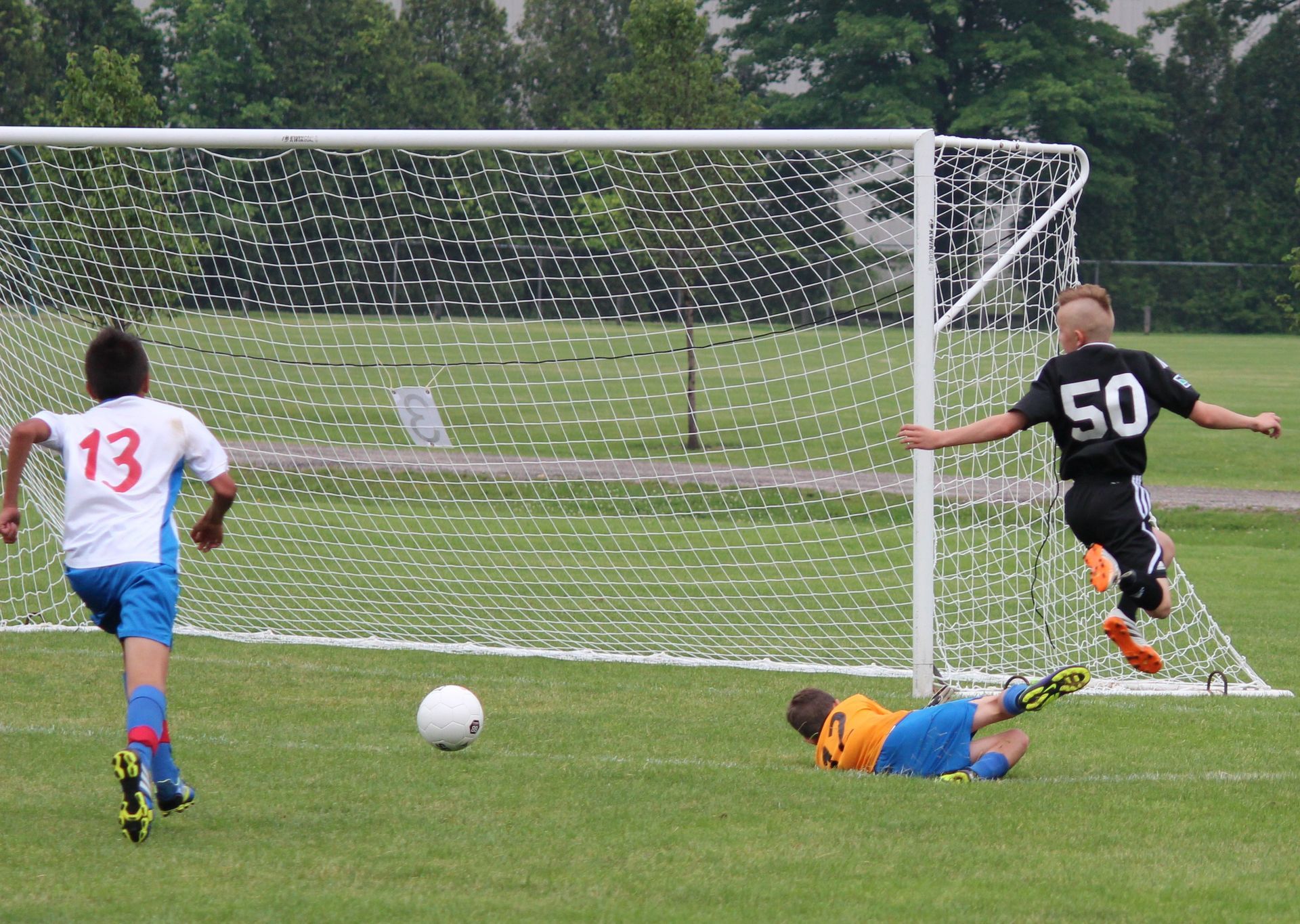 Team Challenger FC player scoring a goal