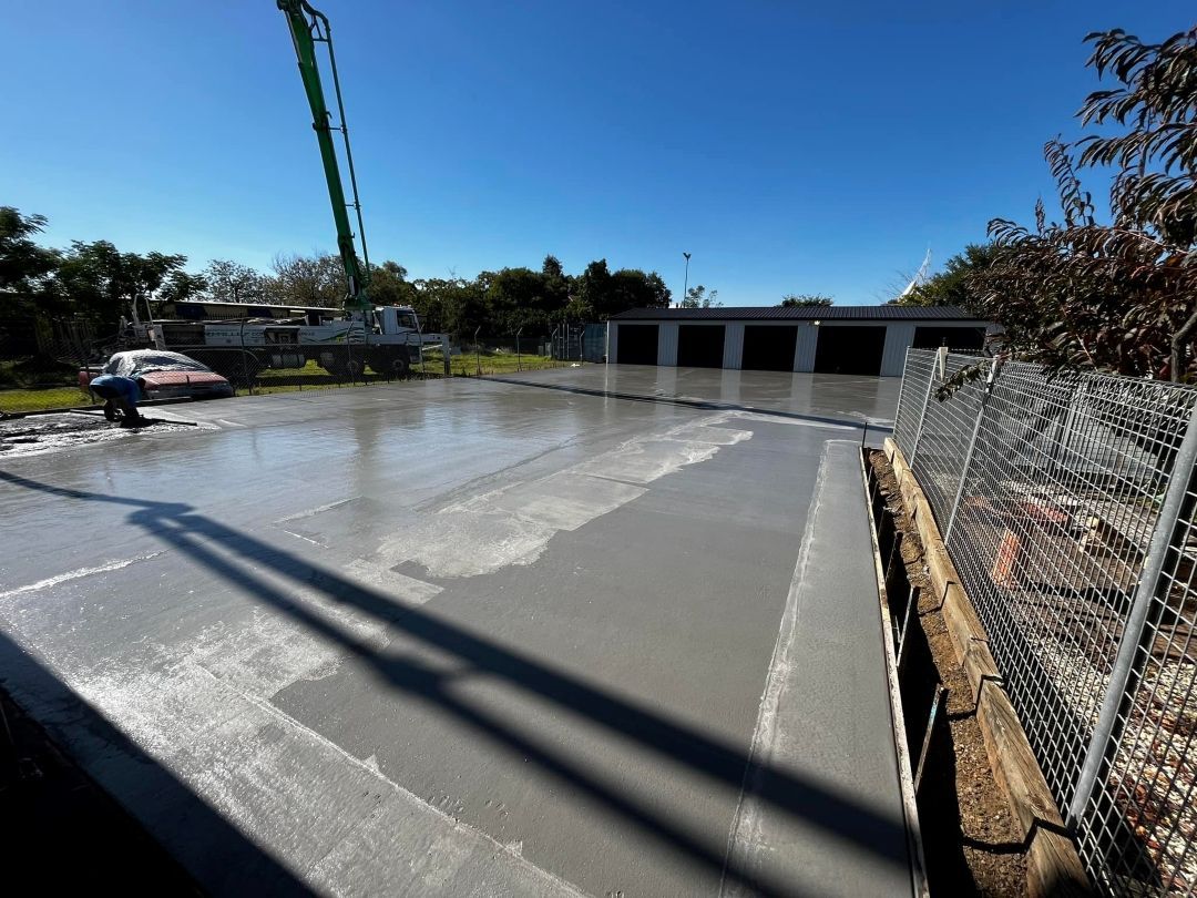 A Concrete Floor is Being Poured by a Crane — All Aspects Concreting & Earthworks Pty Ltd in Dubbo, NSW