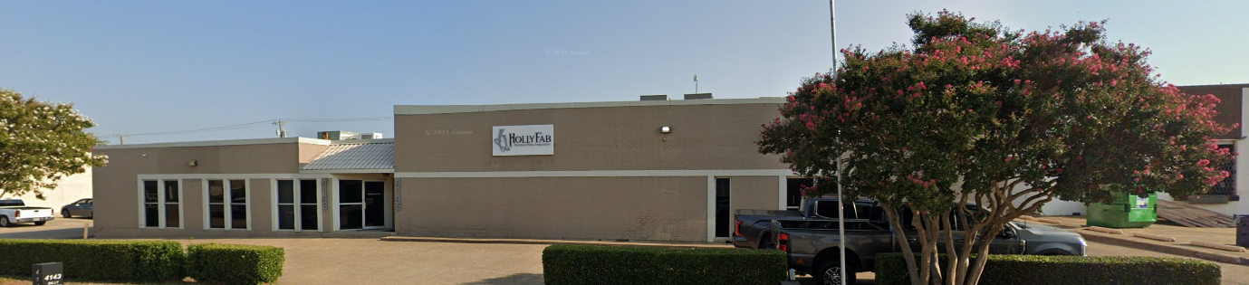 Tan building with a sign that says