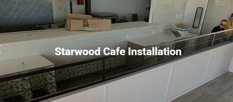 Installation of a Starwood Cafe bar. Interior view with white and black design elements.