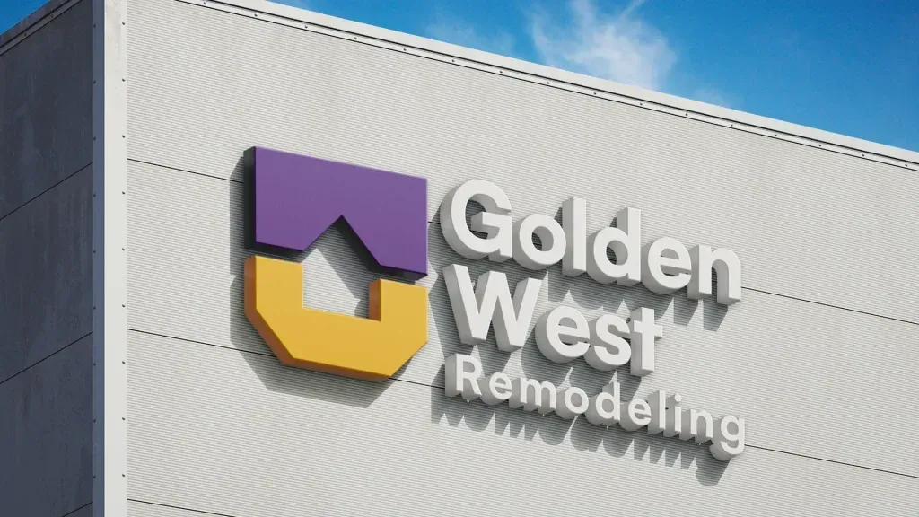 Golden West Remodeling sign on a building wall with purple and gold logo