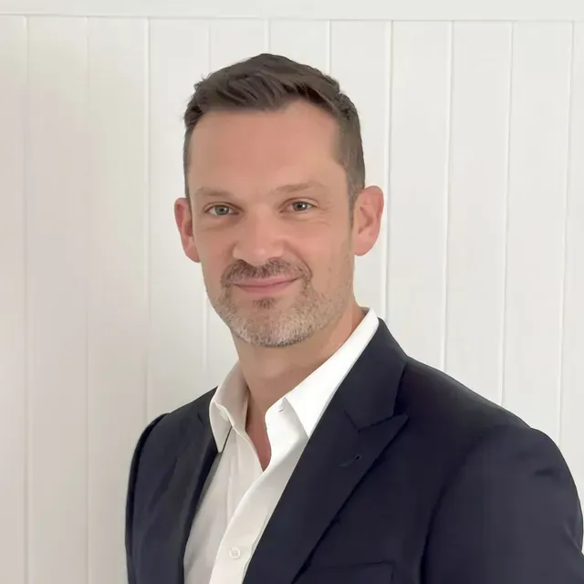 Professional business executive in suit representing fractional CFO and COO leadership services for FMCG brands