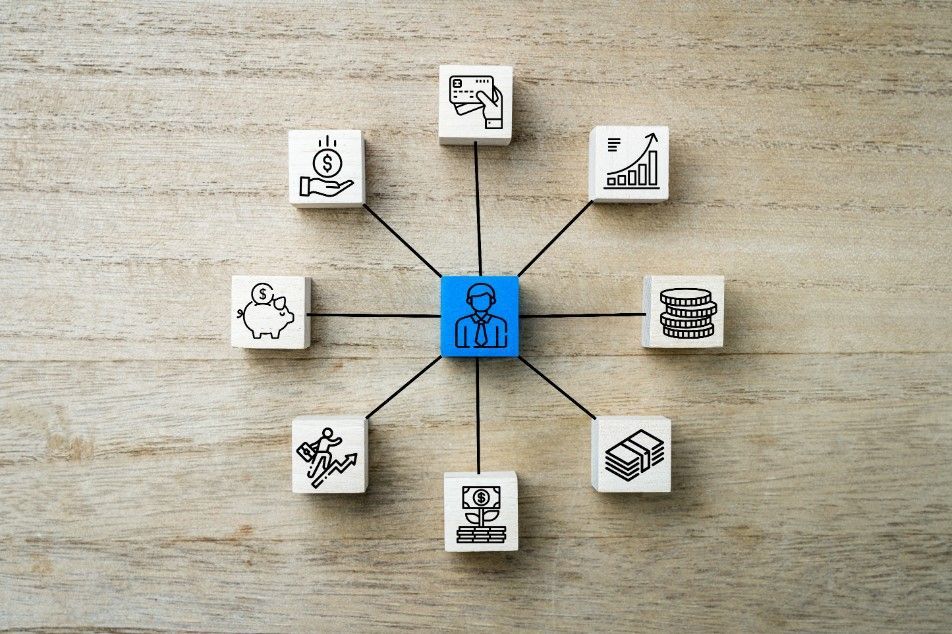 A Person Is Surrounded By Icons On A Wooden Table