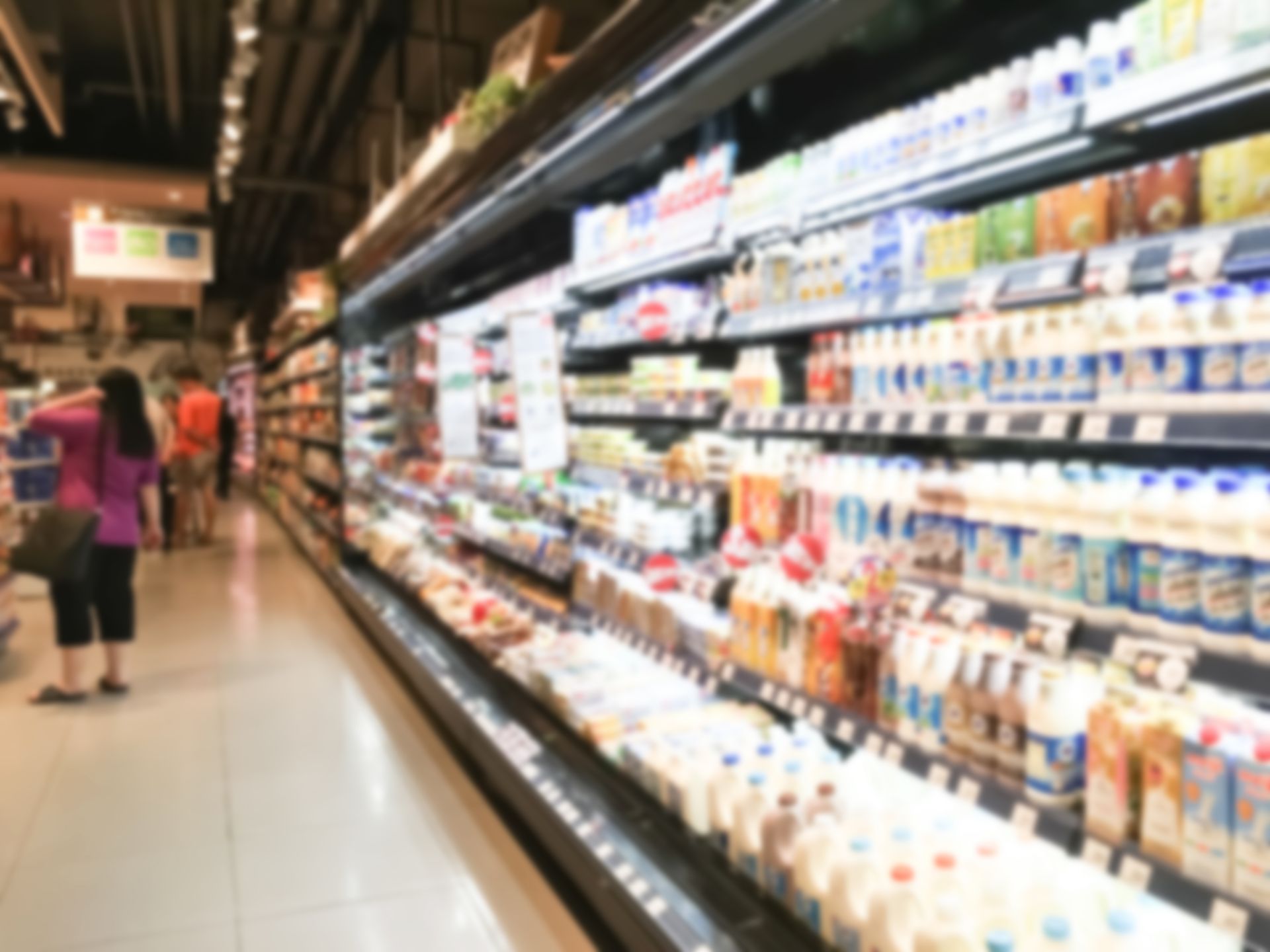 Supermarket dairy aisle stocked with FMCG products – improving DIFOT through VRP planning