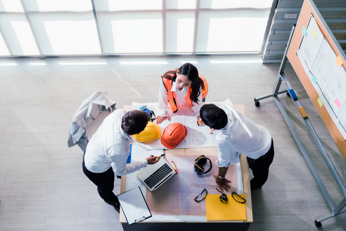Engineers are discussing on a point